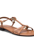 Brown sandal with thin straps on a white background
