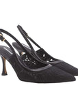 Black high-heeled shoes with slingback design on a white background