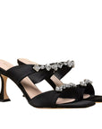 angled view of Mi/Mai Raina mules in black satin