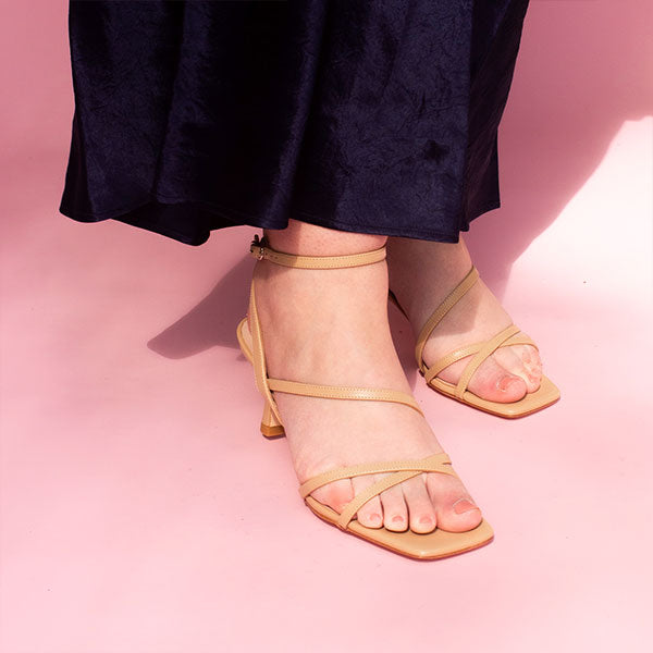 Mi/Mai Venice strappy sandal with ankle strap in beige leather styled with navy dress for Spring event