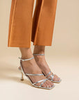Mi/Mai Venice strappy sandal with ankle strap in metallic silver leather styled with smart trousers