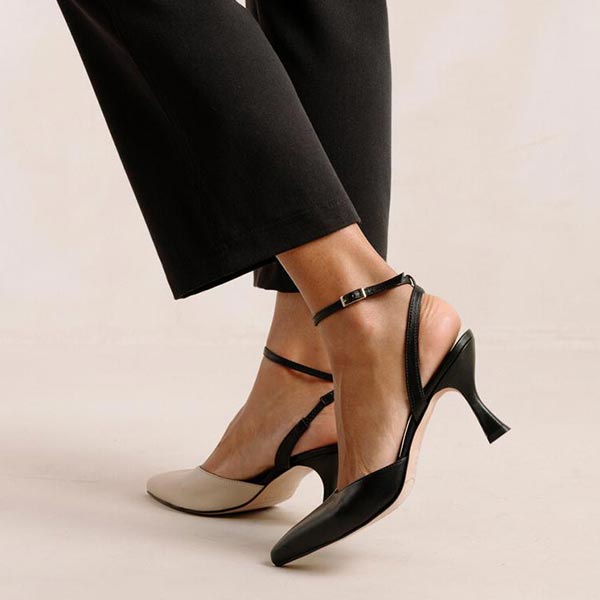 ALOHAS Cinderella black and white leather pumps on model