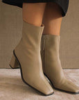 ALOHAS west cape cactus warm beige ankle boot on model wearing black skirt