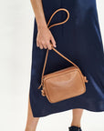 Mint & Rose cassis tan leather crossbody bag lifestyle shot 1