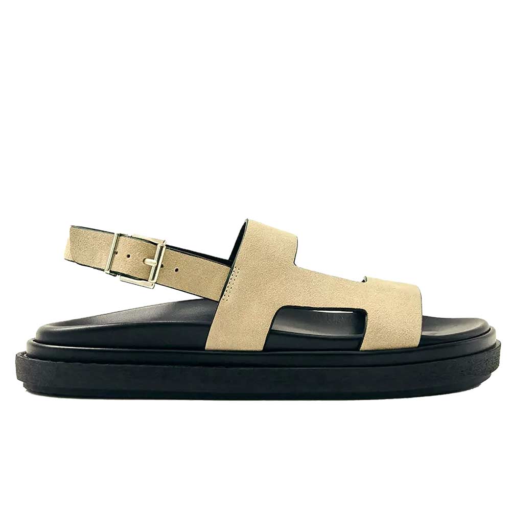 Beige sandal with black sole on a white background