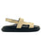 Beige sandal with black sole on a white background