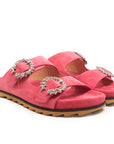 Coral pink suede JUAL slides showing the moulded footbed and crystal buckles.