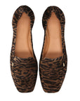 pair of leopard print suede loafers shot from above on a white background