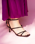  Mi/Mai Venice strappy sandal in black satin styled with bold orchid purple silk dress for Spring