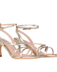 angle view of Mi/Mai Venice strappy sandal  with ankle strap in soft metallic gold leather 