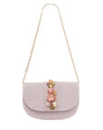 NALÌ CARLA clutch in lilac with sd flower embellishments and gold shoulder chain on white background