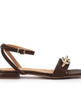 Side view of Pedro miralles Villena sandals in chocolate brown with gold chain detail.