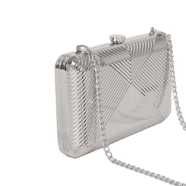 Silver metal hard shell clutch in art deco pattern with silver chain strap 