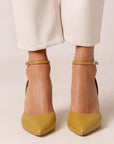 Alohas Cinderella marigold leather pumps on model wearing white cropped jeans