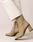ALOHAS west cape cactus warm beige ankle boot on model wearing white cropped jeans