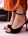 Lola cruz kaira black suede high heel sandal on model 