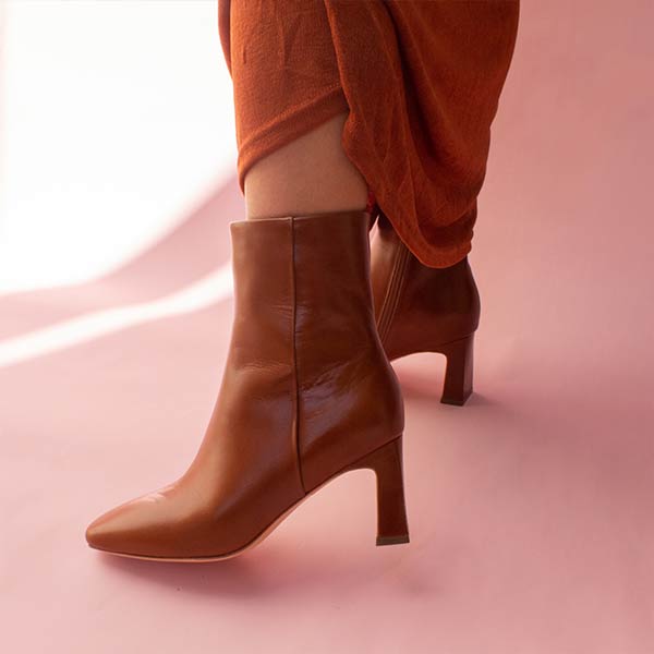Mi/Mai Darcy ankle boot in brown leather on model with terracotta skirt