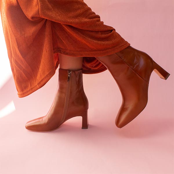Mi/Mai Darcy ankle boot in brown leather on model with terracotta skirt