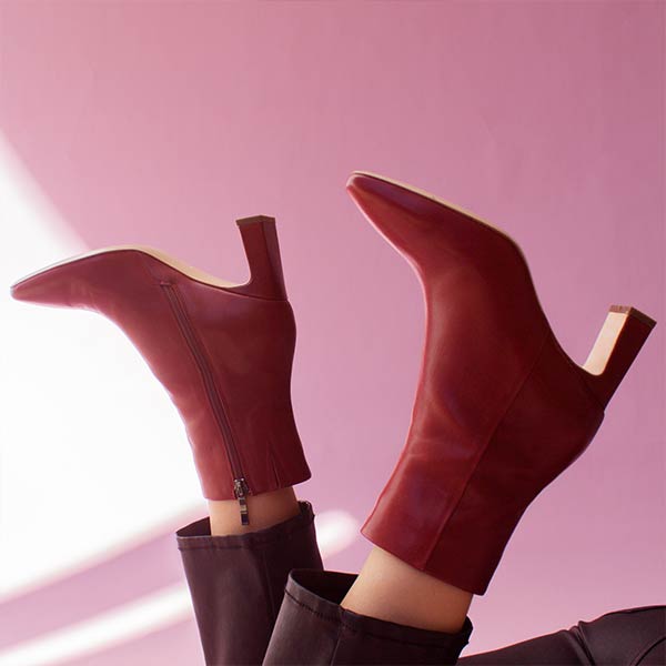 Mi/Mai Darcy mid heel ankle boot in red leather on model on pink background
