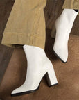 Sylven New York Almasi white apple leather boot on model 2