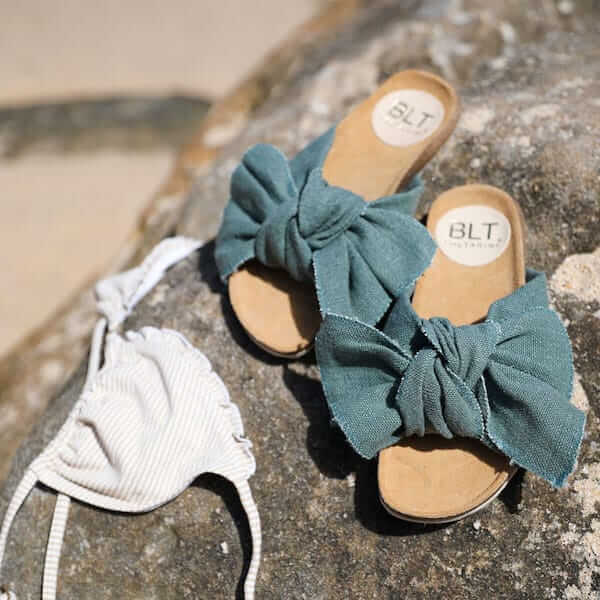 Claudie by Baltarini Flat linen bow slide lifestyle shot